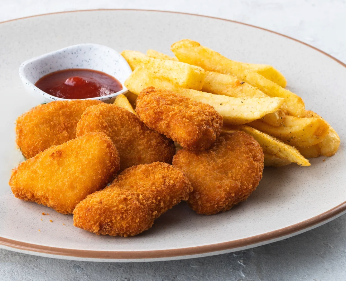 Chicken nuggest and chips on a plate